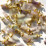 Flourit smycken i lila och grön färg